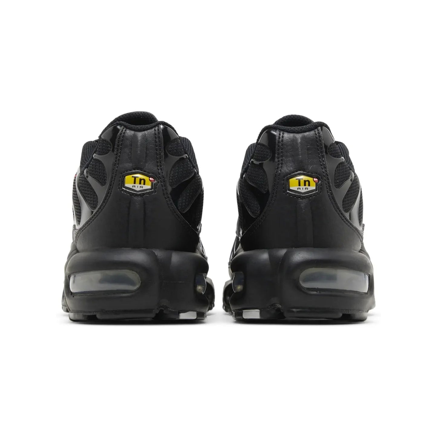 Black sneakers with a visible brand logo on a white background