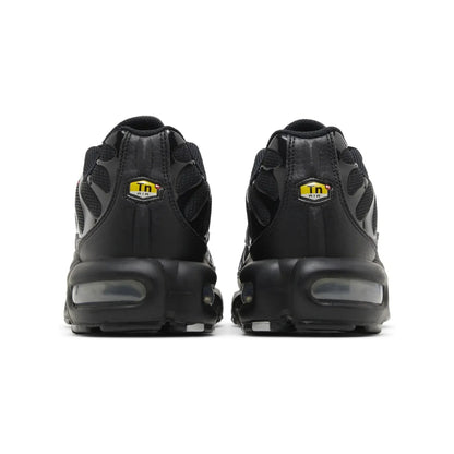 Black sneakers with a visible brand logo on a white background