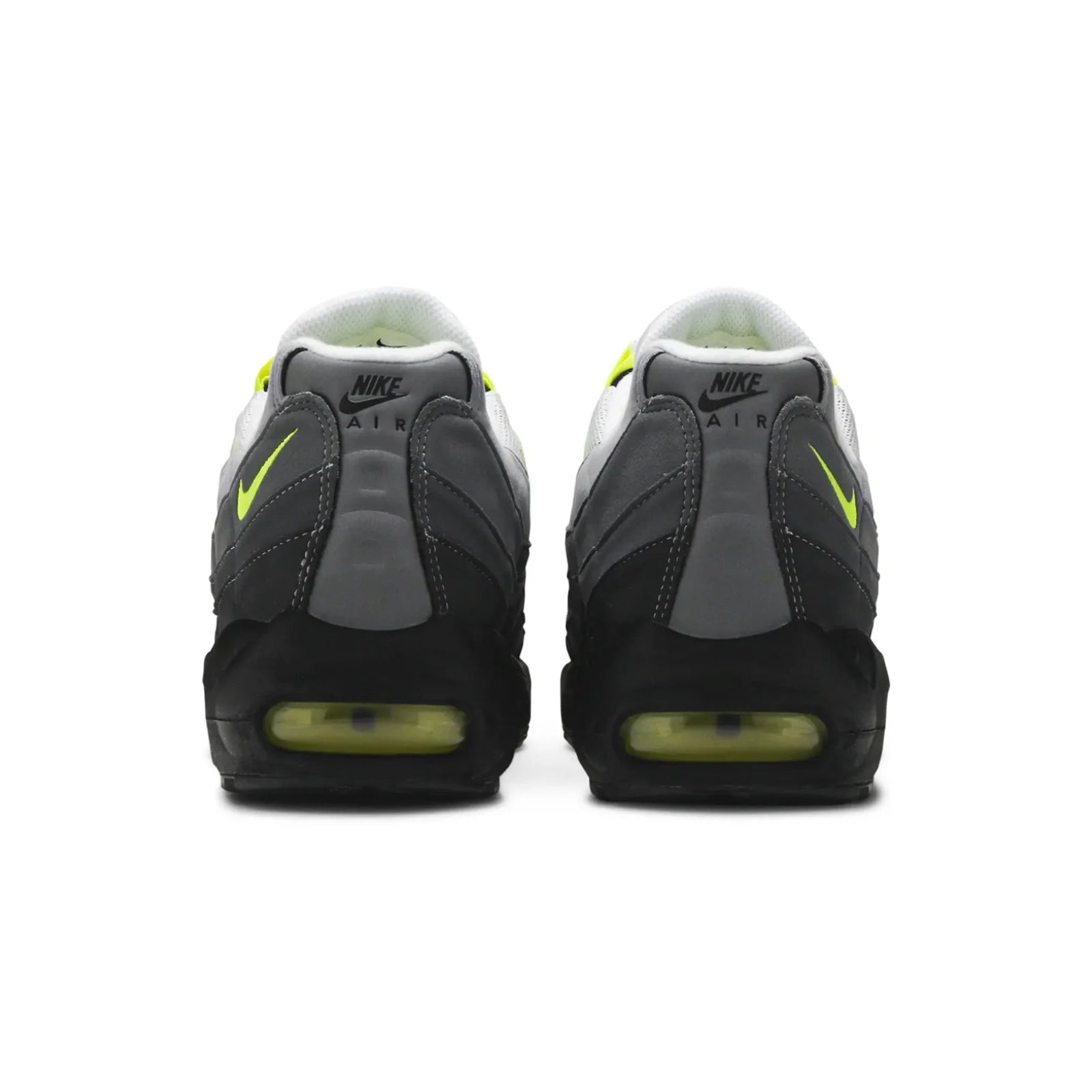Pair of Nike Air Max sneakers with black, gray, and yellow design on a white background