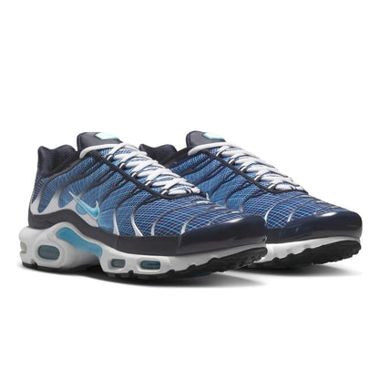 Blue and black athletic shoes with a white background