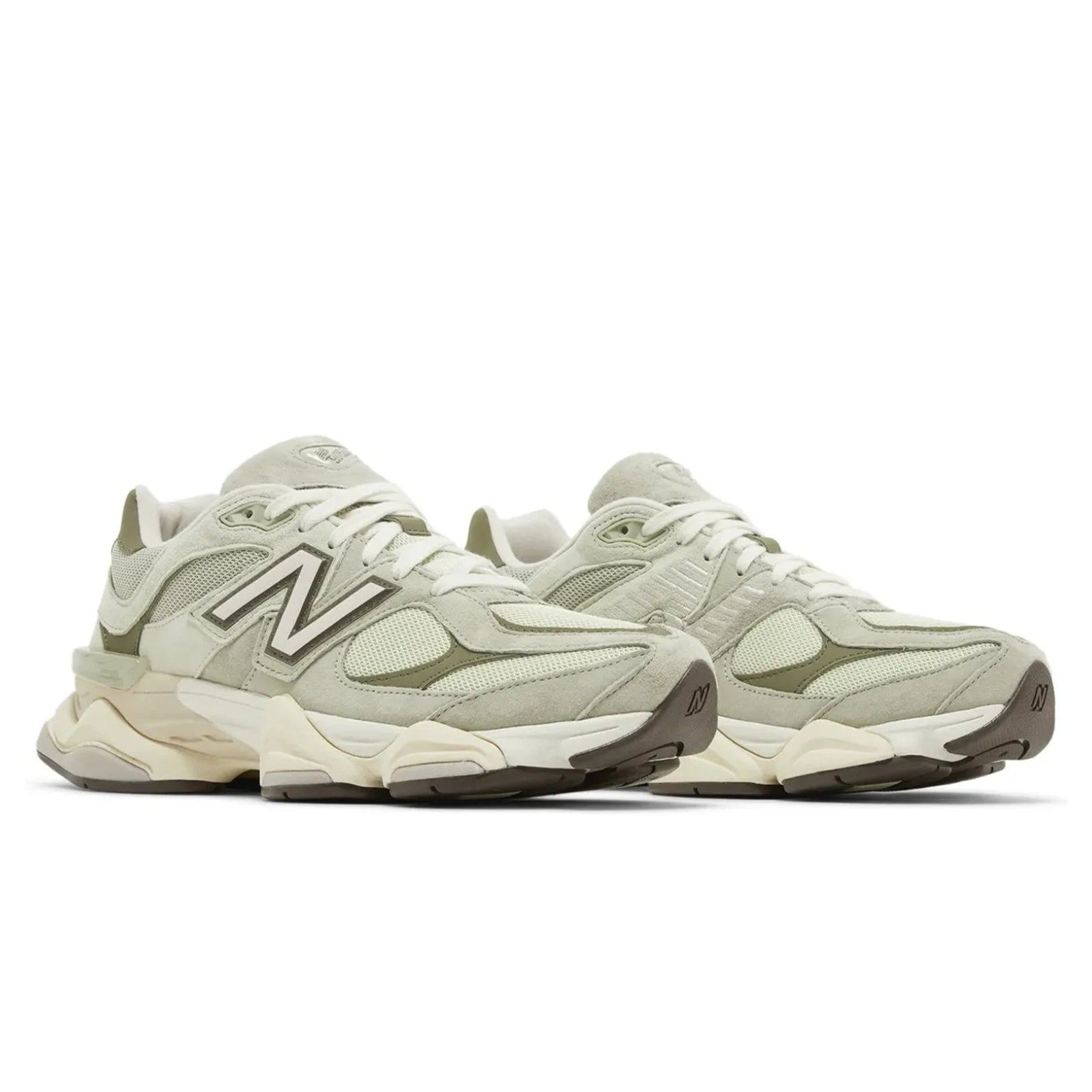 Pair of beige sneakers with New Balance logo on a white background