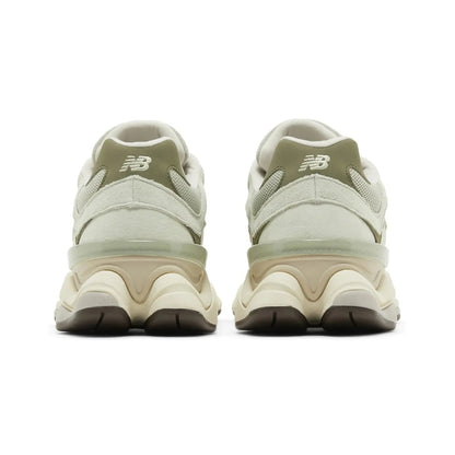 Pair of New Balance sneakers shown from the back on a white background