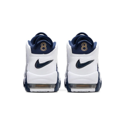 Pair of white sneakers with navy accents and gold number 8 on a white background