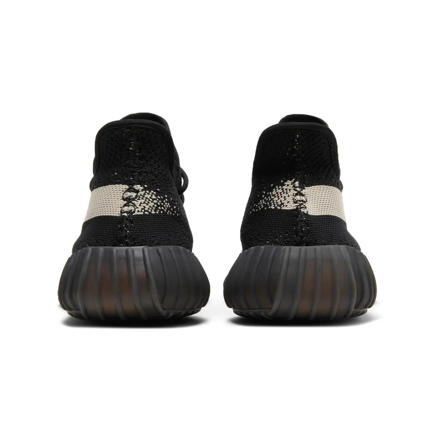 Black and white sneaker with textured sole on a white background