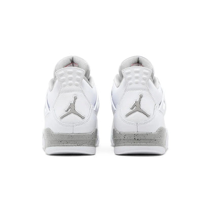 White sneakers with a logo on a white background