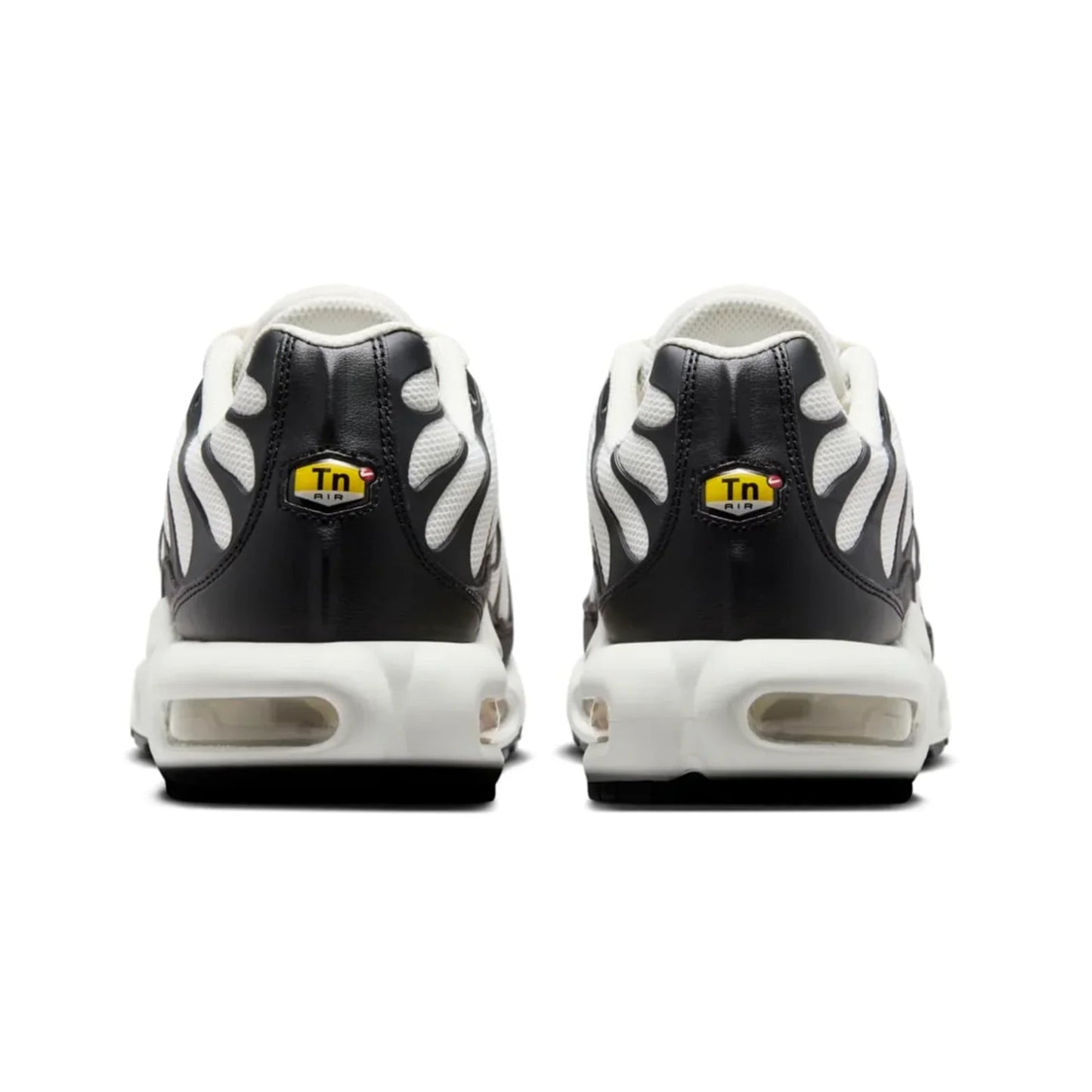 Black and white sneakers with a yellow logo on a white background