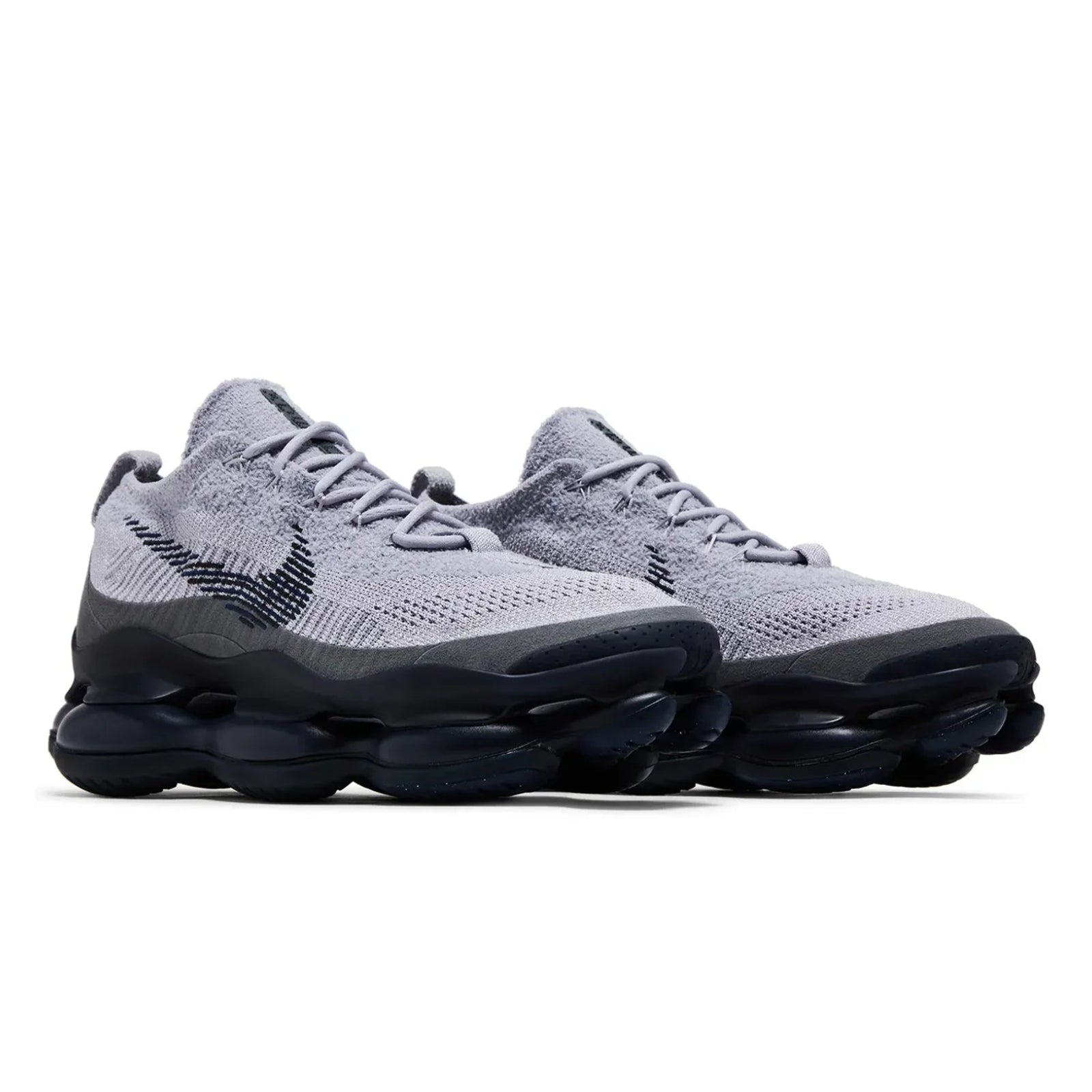 Gray sneakers with black soles on a white background