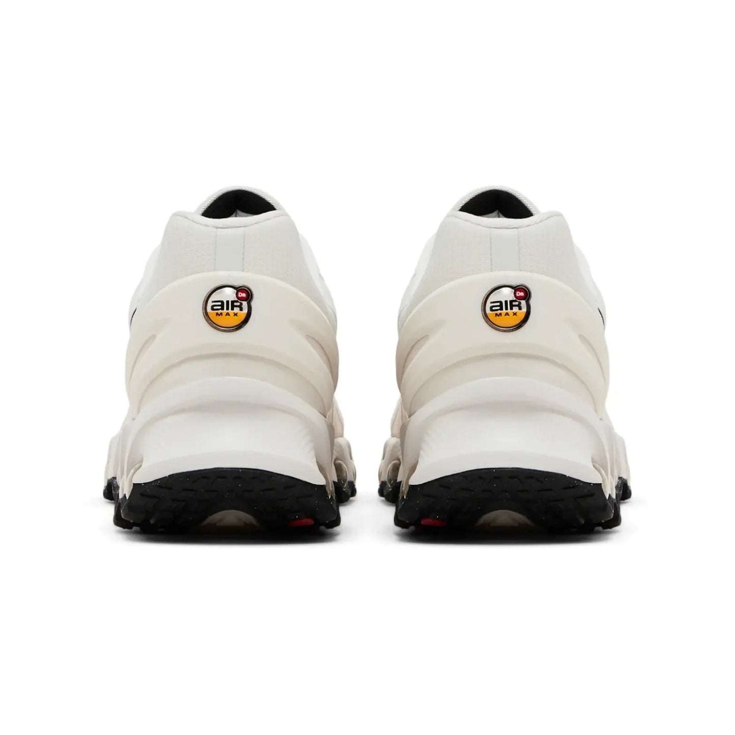 White sneakers with black soles on a white background