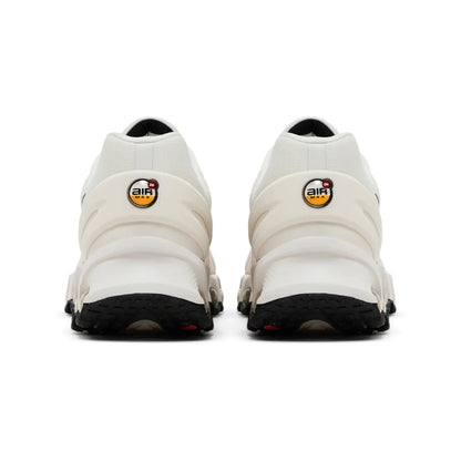 White sneakers with black soles on a white background