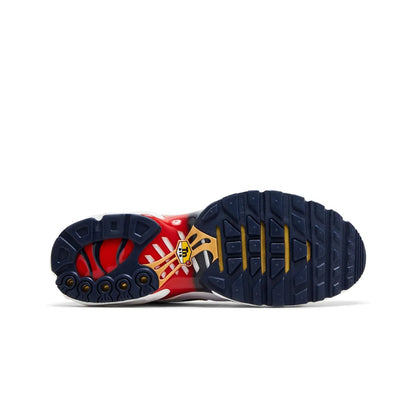 Sole of a sneaker with red, white, and blue design on a white background