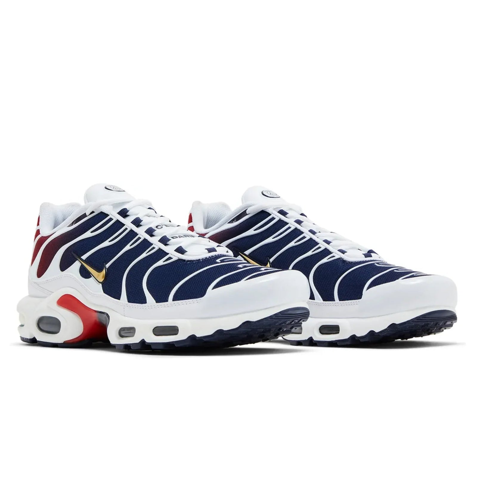 Pair of white, blue, and red sneakers on a white background