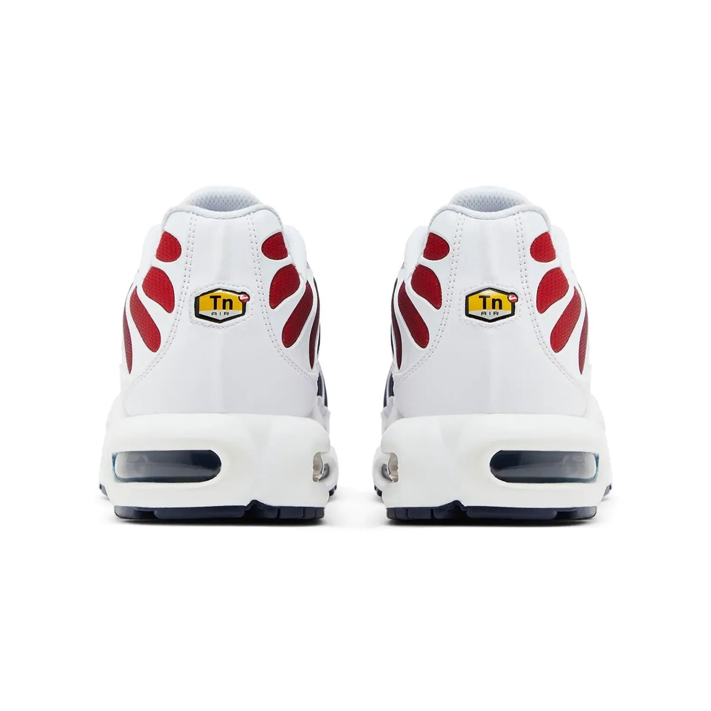 White sneakers with red paw prints and yellow labels on a white background