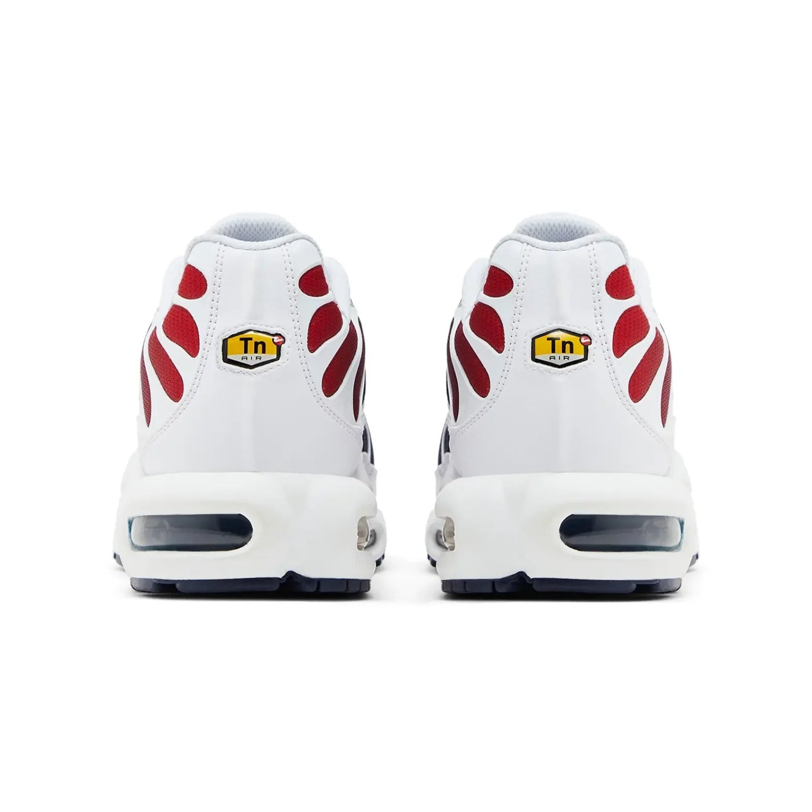 White sneakers with red paw prints and yellow labels on a white background