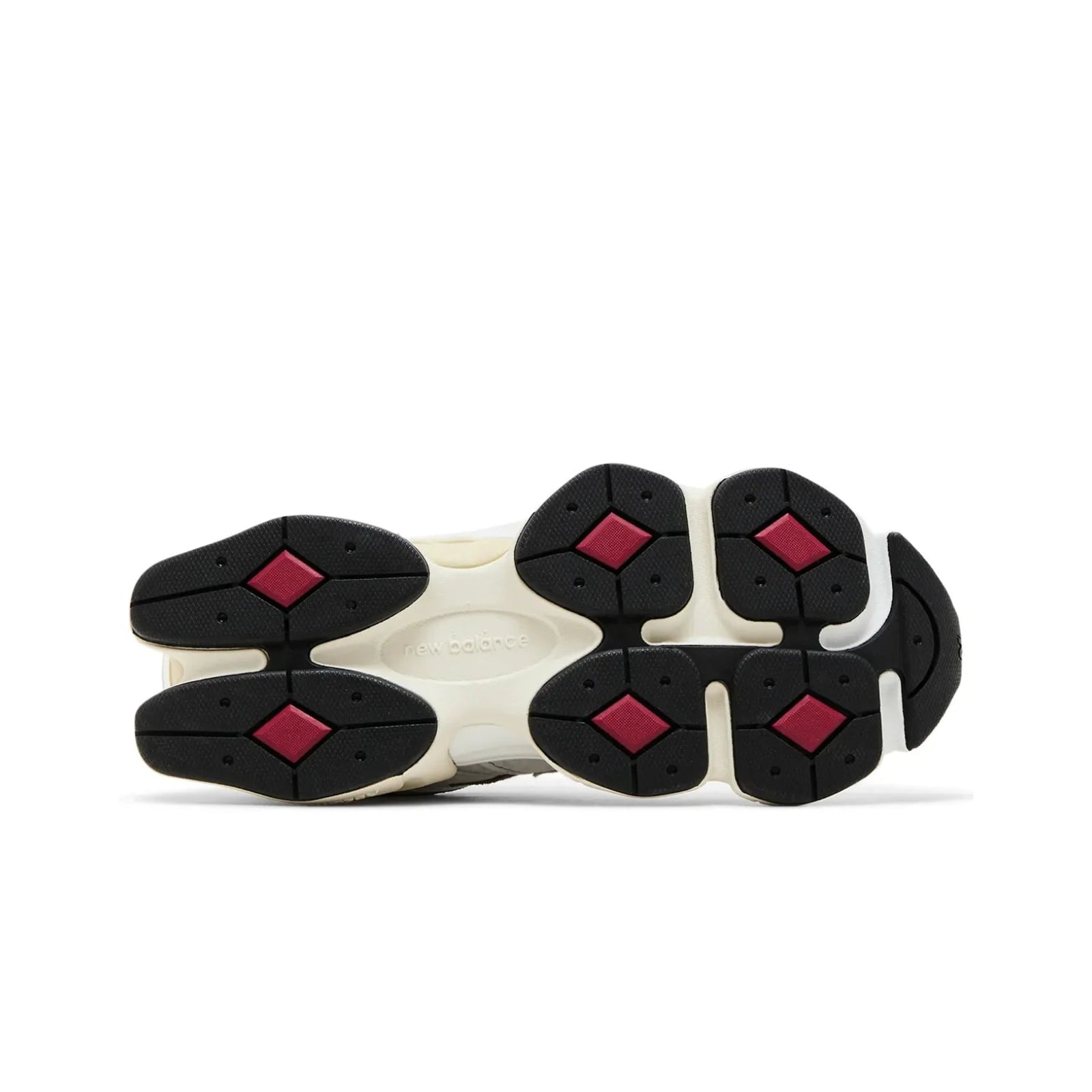 Sole of a sneaker with red and black pattern on a white background