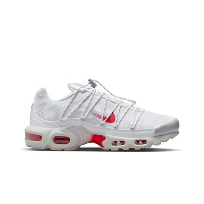 White sneaker with red accents on a white background