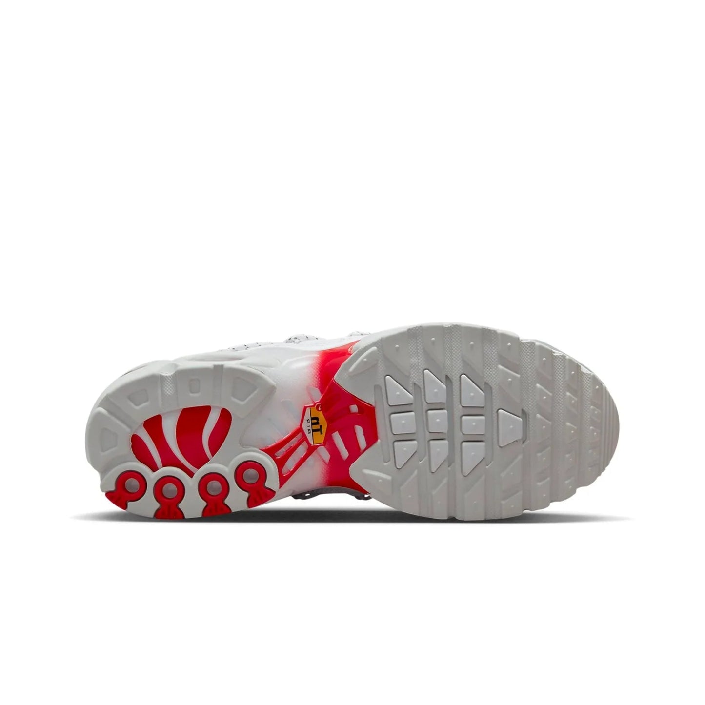 Sole of a white shoe with red accents on a white background