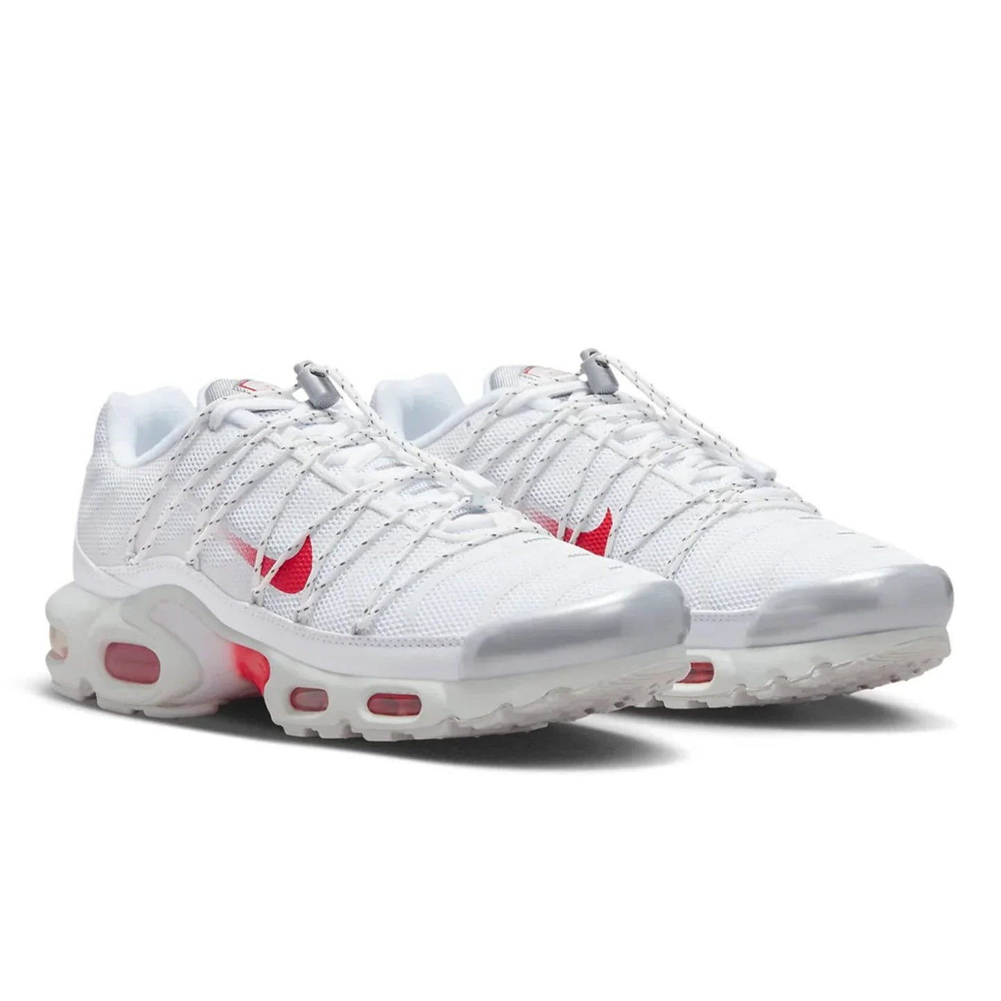 White sneakers with red accents on a white background