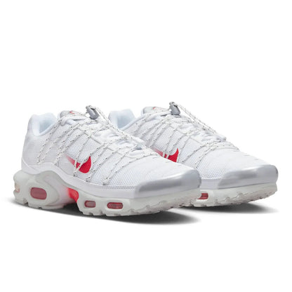 White sneakers with red accents on a white background