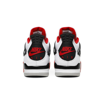 White sneakers with red and black accents on a white background