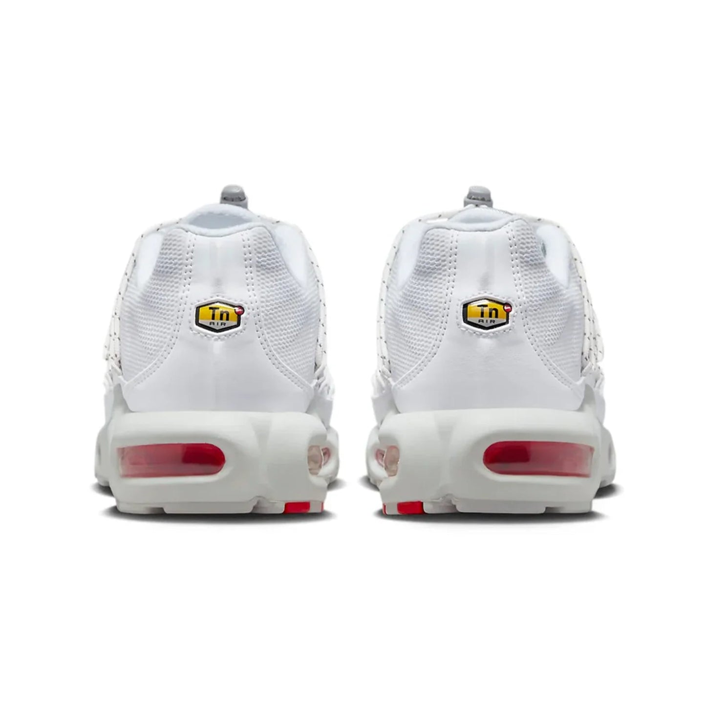White sneakers with red airbags and yellow logos on a white background