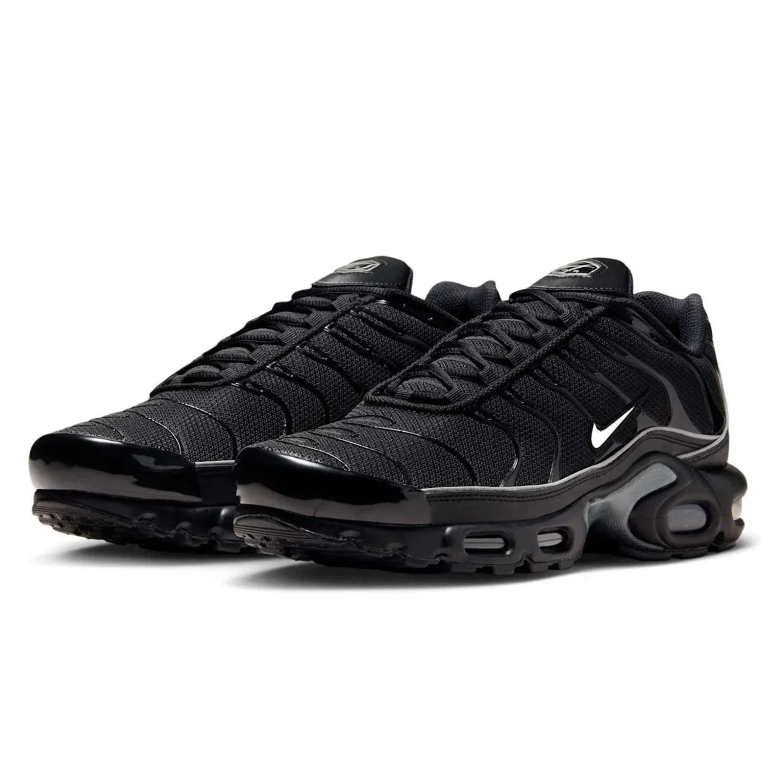Black Nike sneakers on a white background