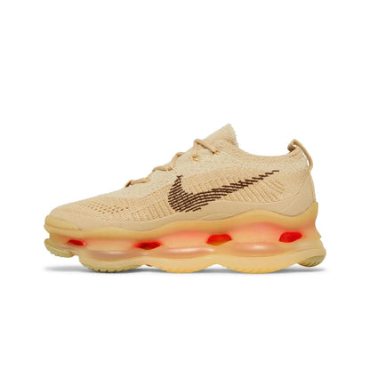 Beige sneaker with a prominent brand logo on a white background