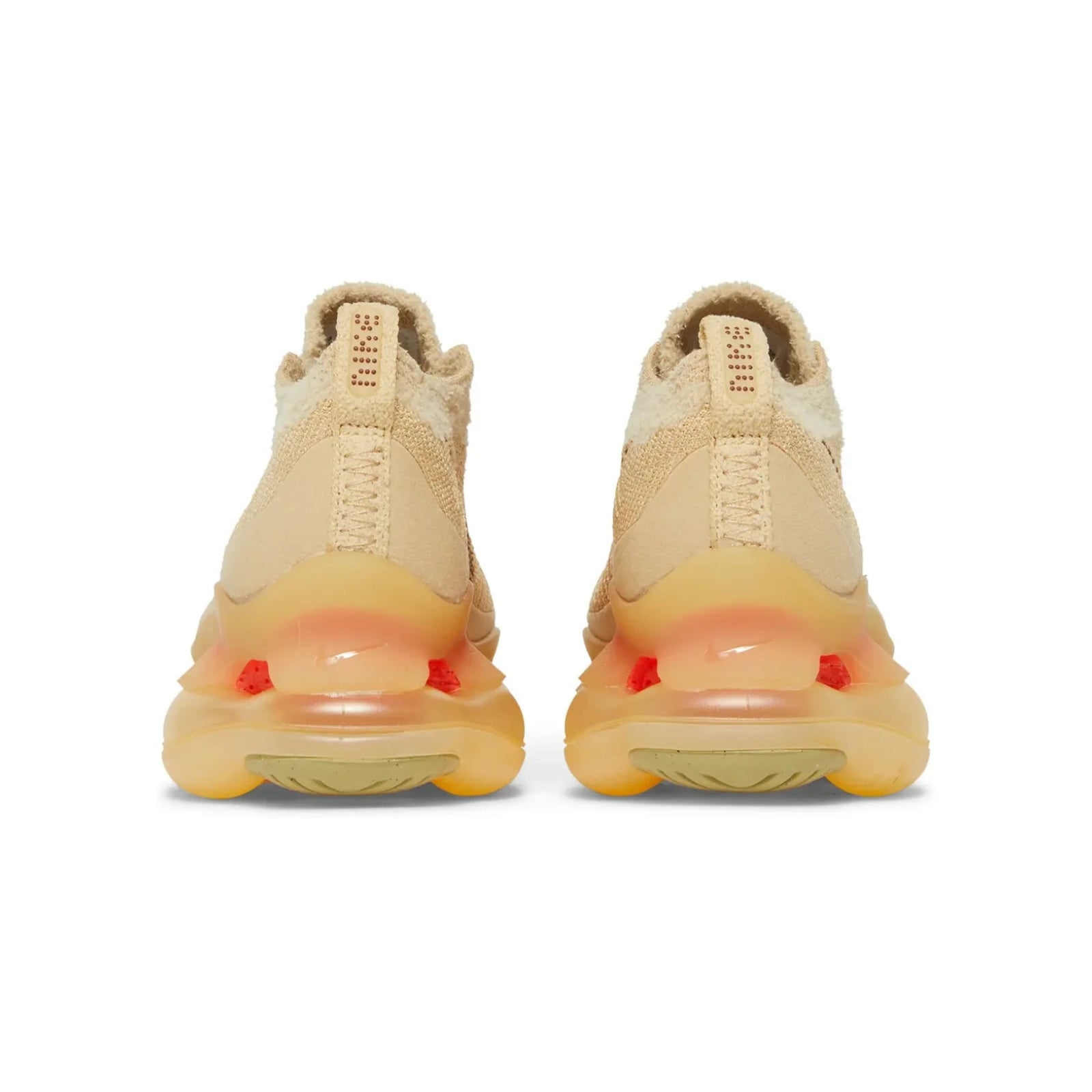 Beige sneakers with a focus on the sole on a white background