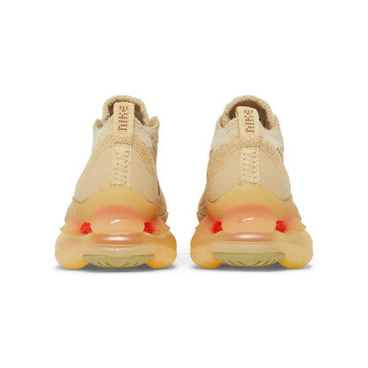 Beige sneakers with a focus on the sole on a white background