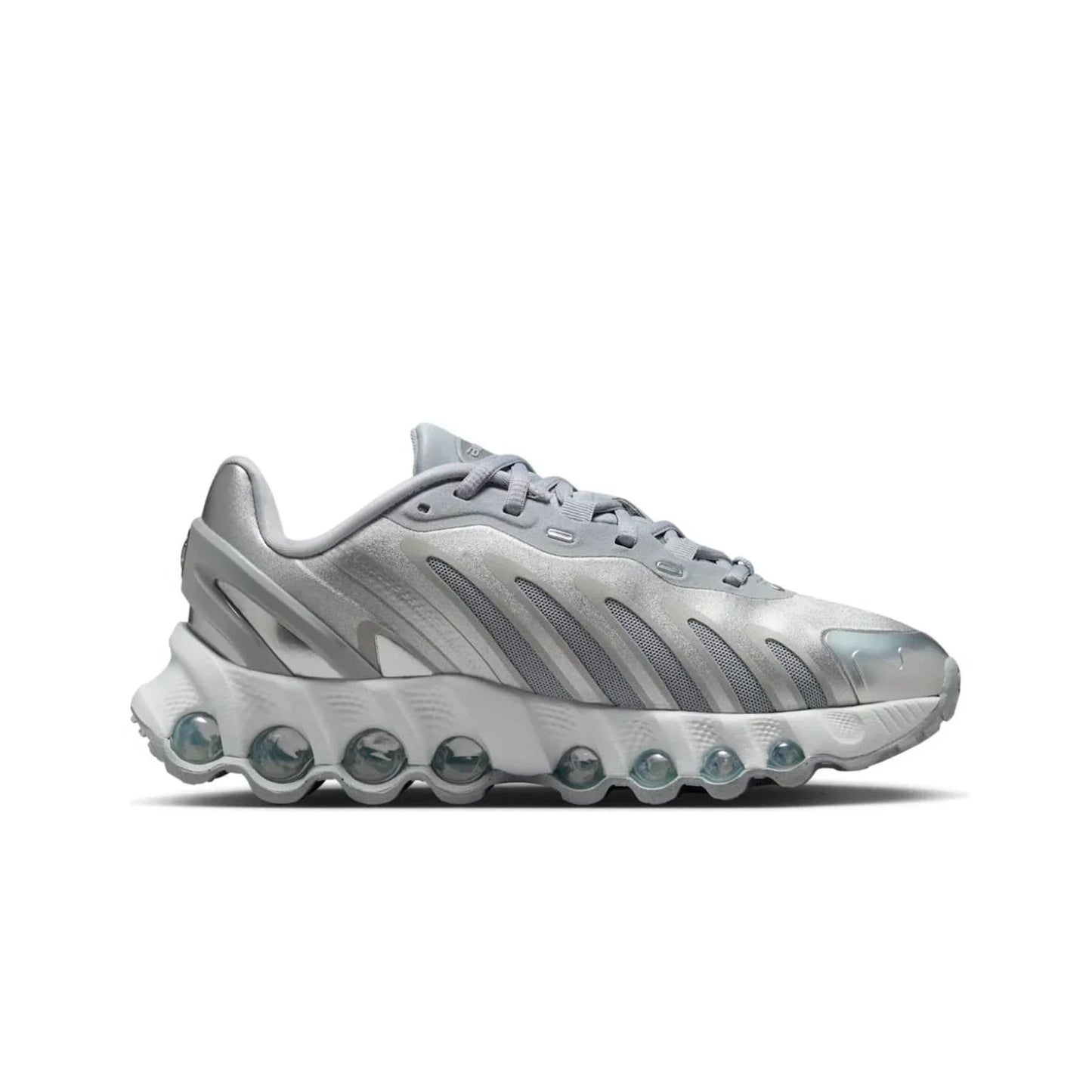 Silver sneaker with unique sole design on a white background