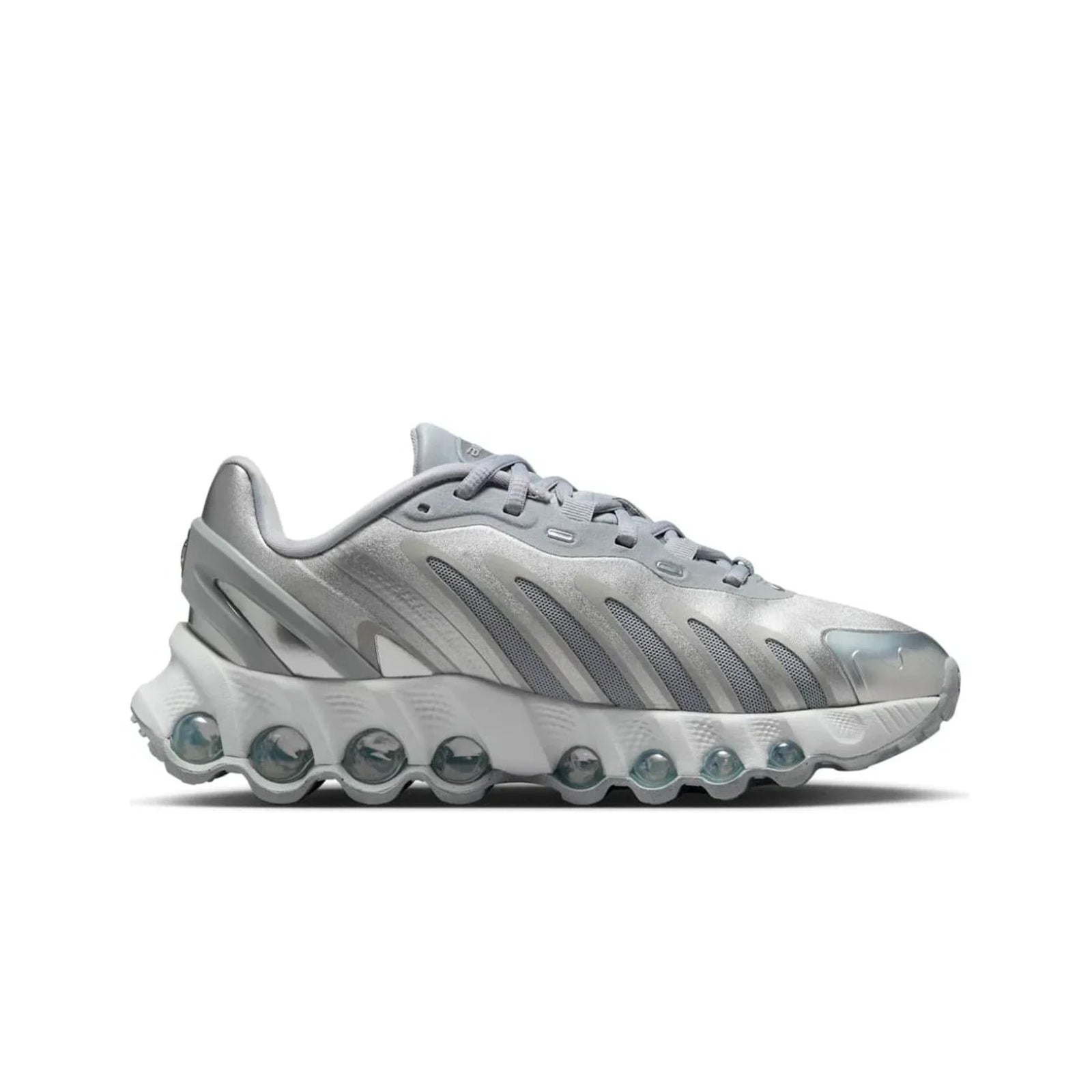 Silver sneaker with unique sole design on a white background