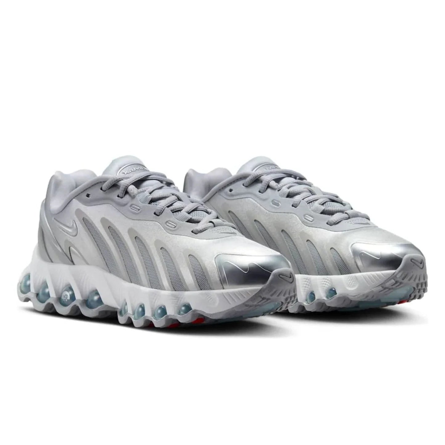 Pair of silver athletic shoes on a white background