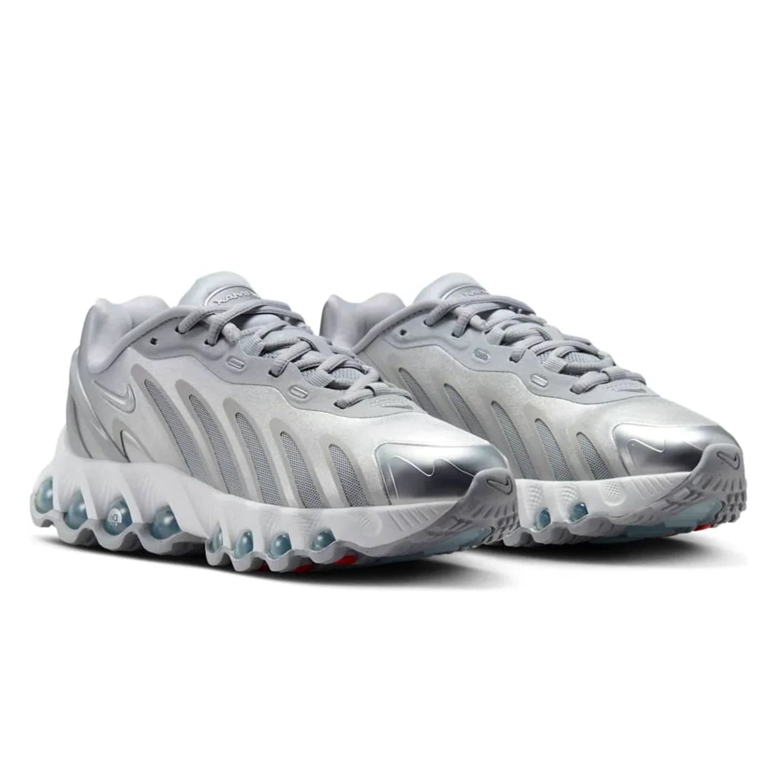 Pair of silver athletic shoes on a white background