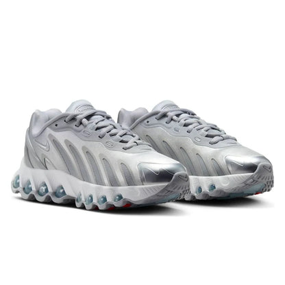 Pair of silver athletic shoes on a white background