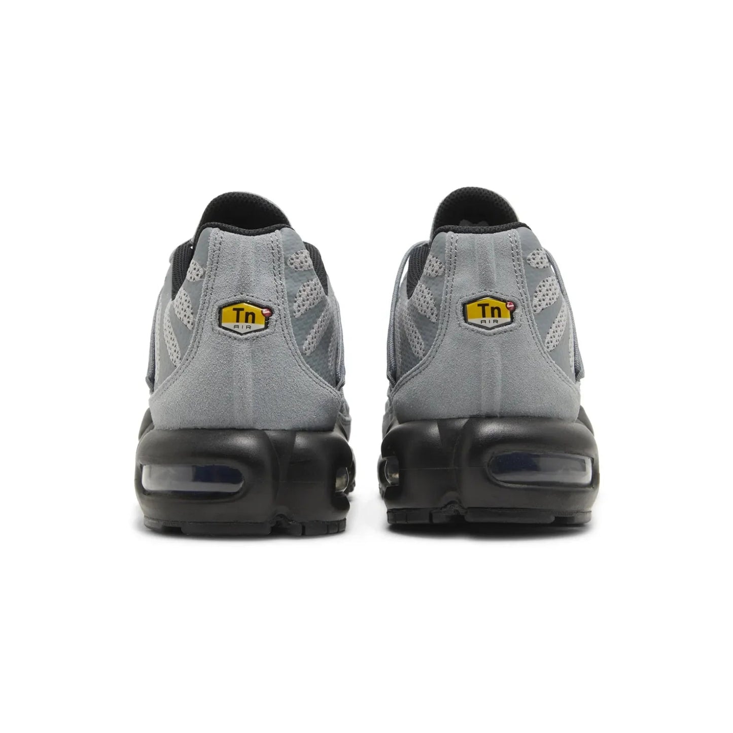 Gray sneakers with black soles on a white background