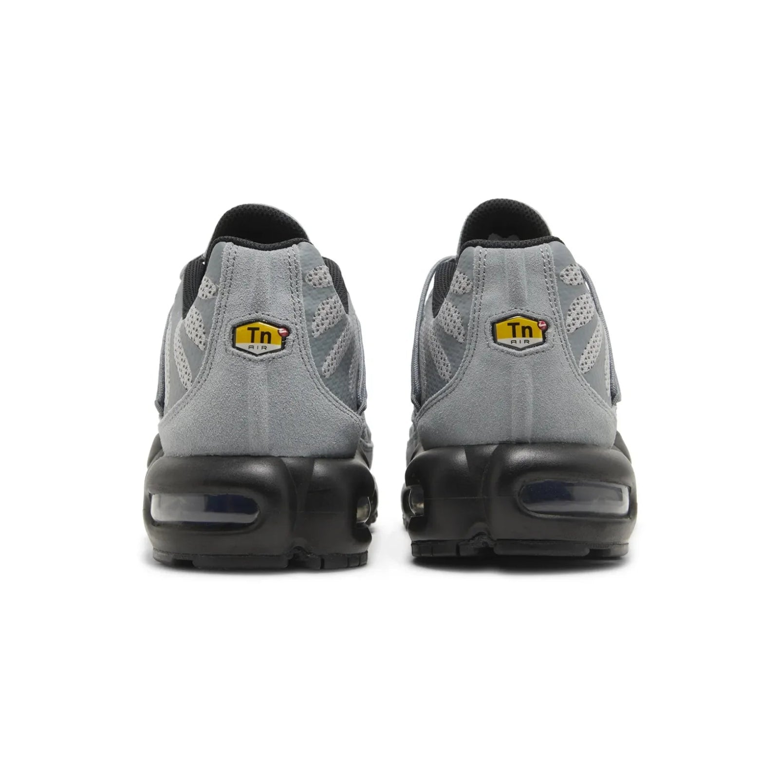 Gray sneakers with black soles on a white background