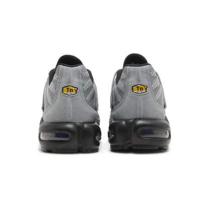 Gray sneakers with black soles on a white background