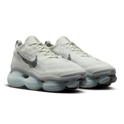 White sneakers with a unique sole design on a white background