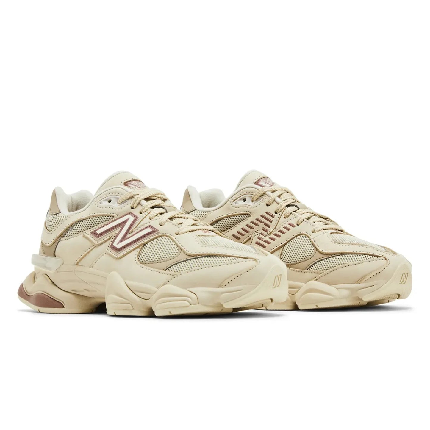 Beige sneakers with a brand logo on a white background