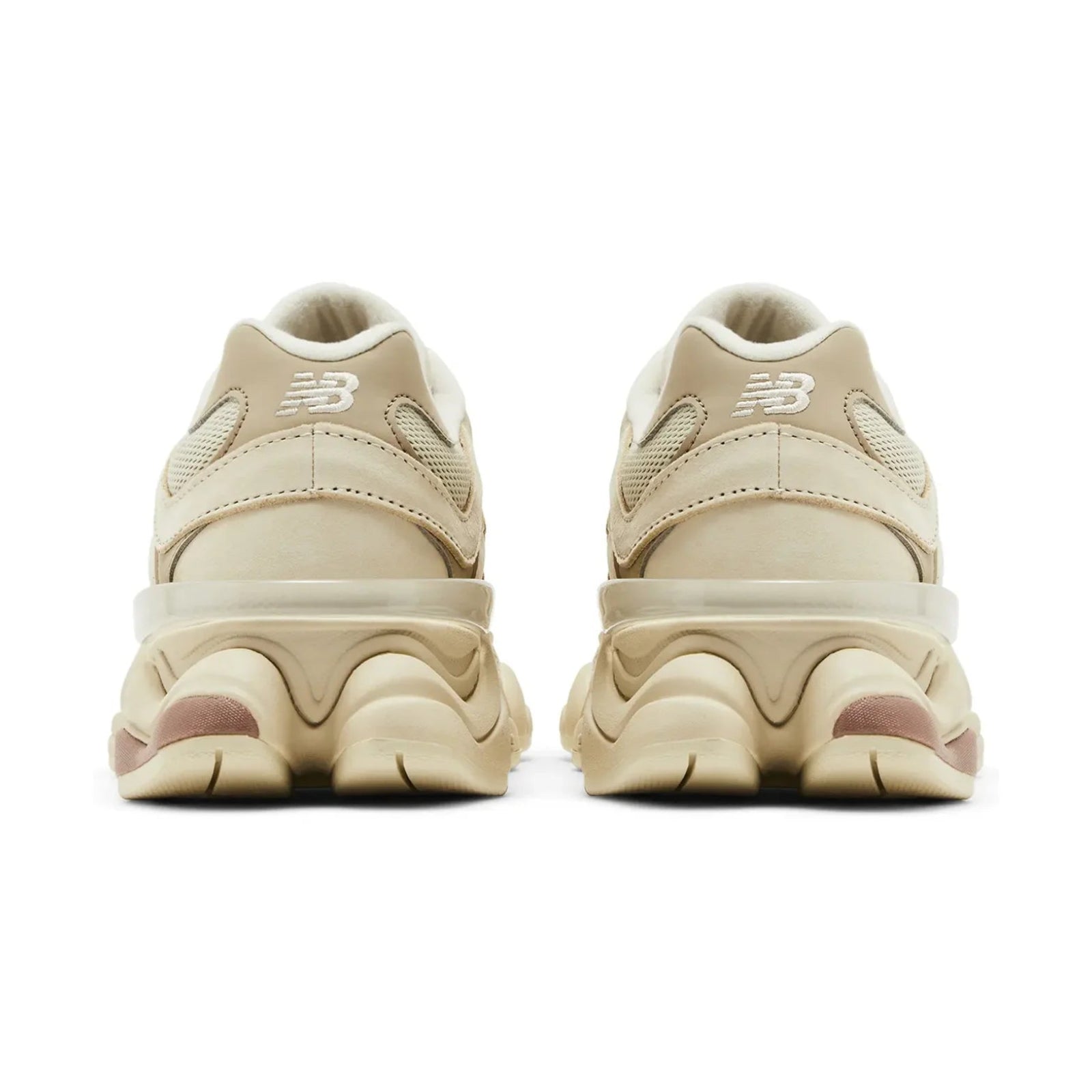 Pair of beige sneakers with a brand logo on a white background