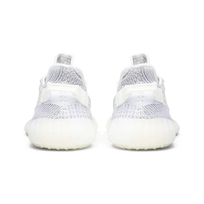 White sneakers with a focus on sole design on a white background