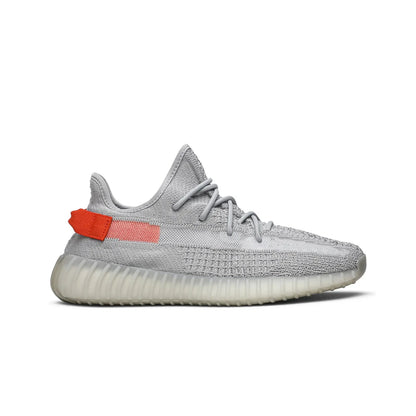 Gray sneaker with a red tag on a white background