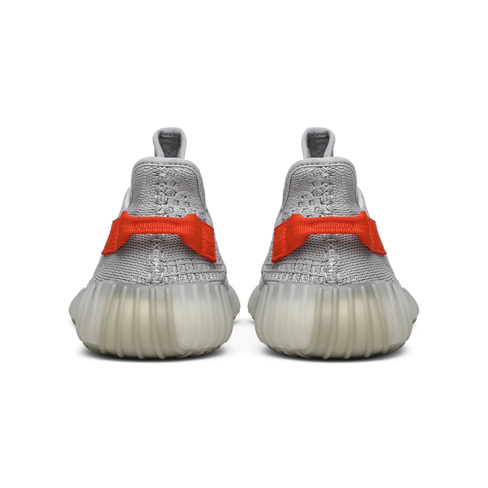 Gray sneakers with orange accents on a white background