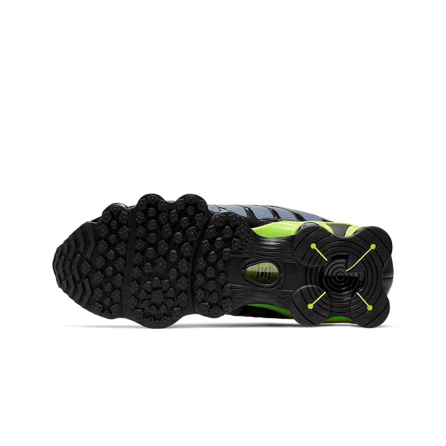 Close-up of a black and green athletic shoe sole on a white background