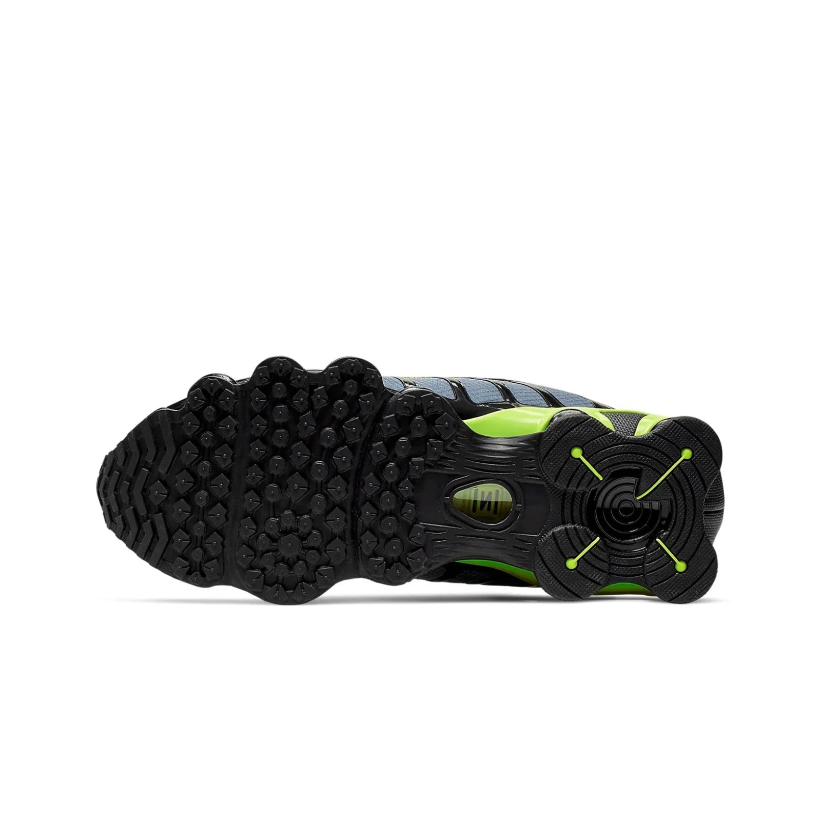 Close-up of a black and green athletic shoe sole on a white background