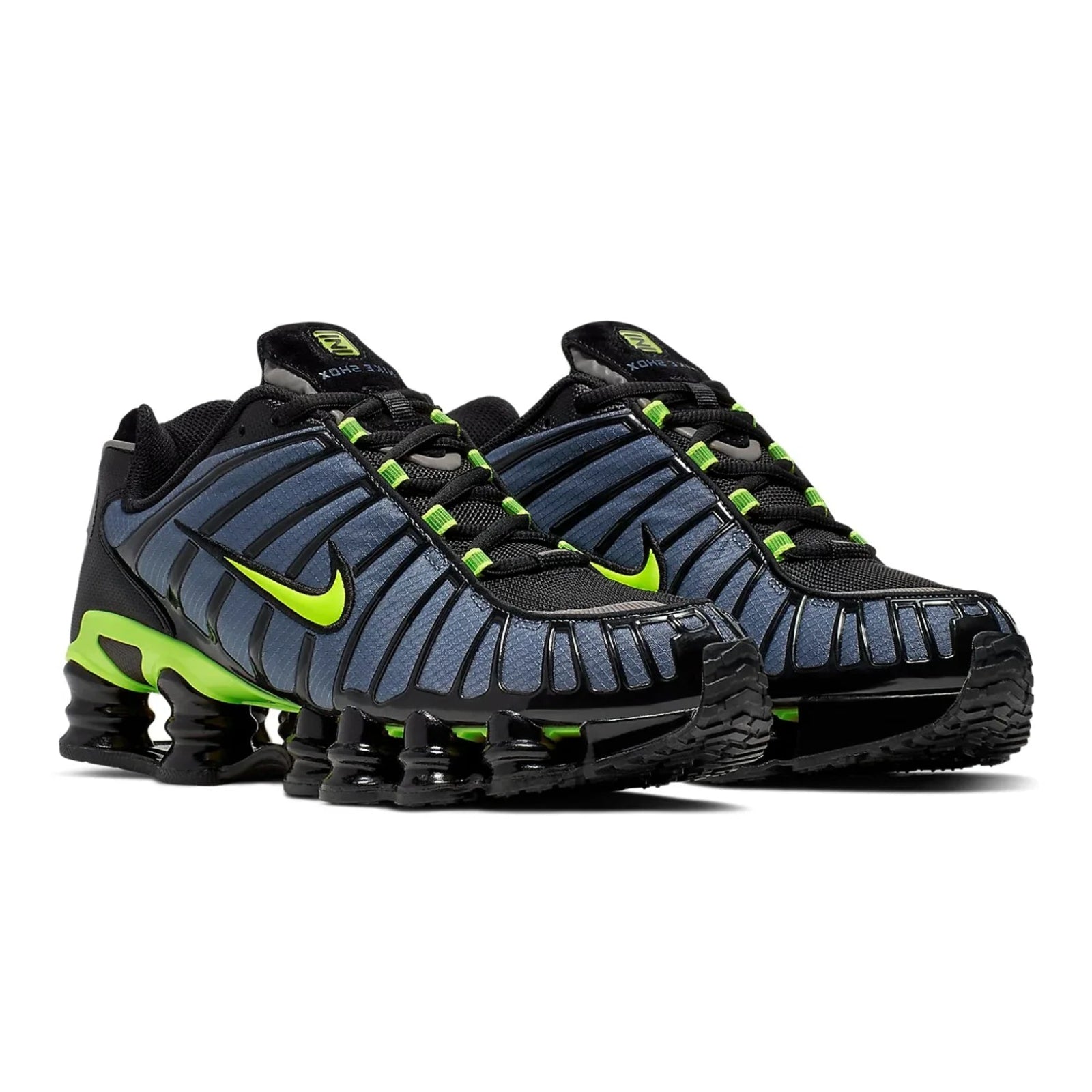 Pair of black and blue athletic shoes with green accents on a white background