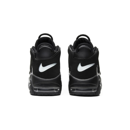 Black Nike sneakers with white swoosh logo on a white background