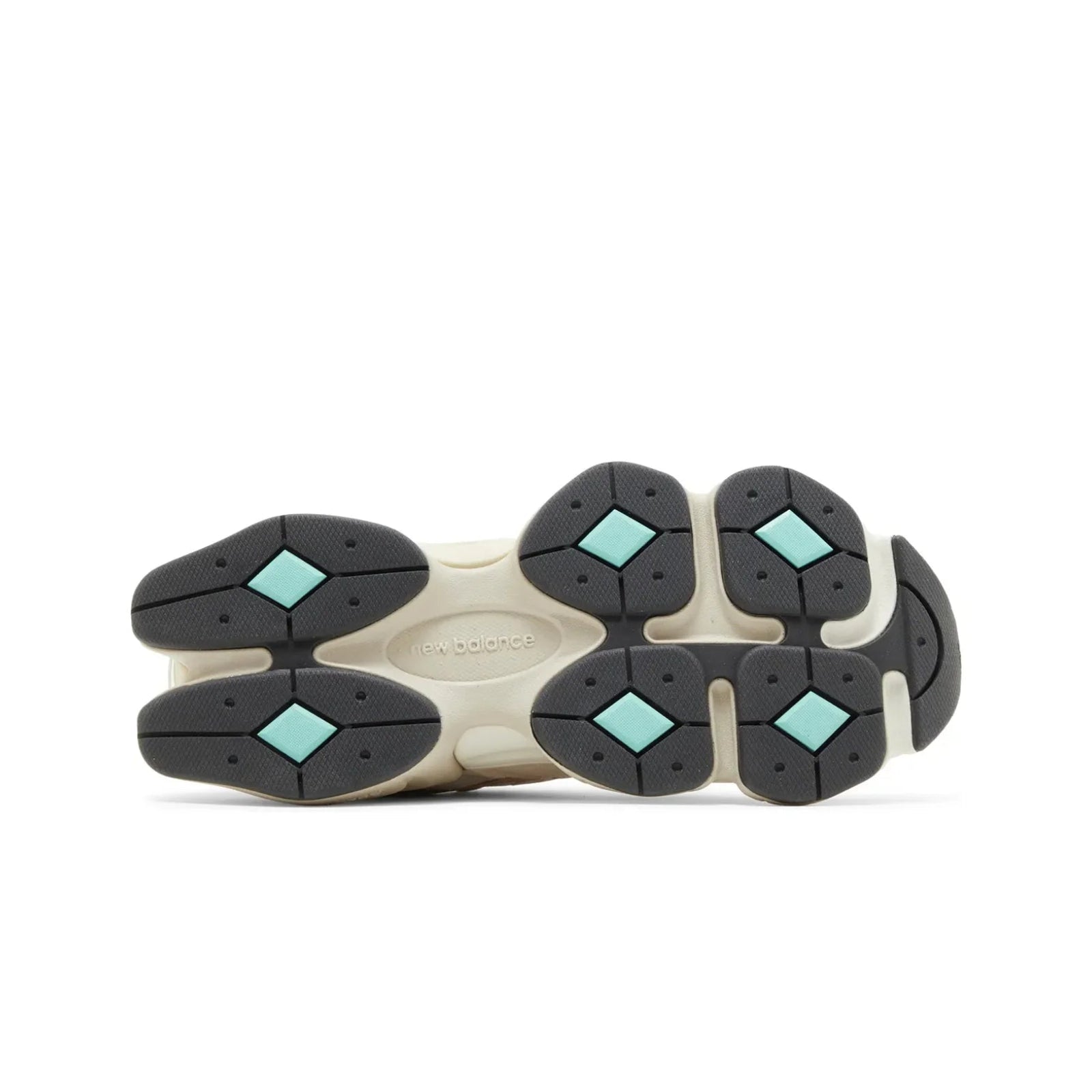 Close-up of a shoe sole with black and gray rubber pods on a white background