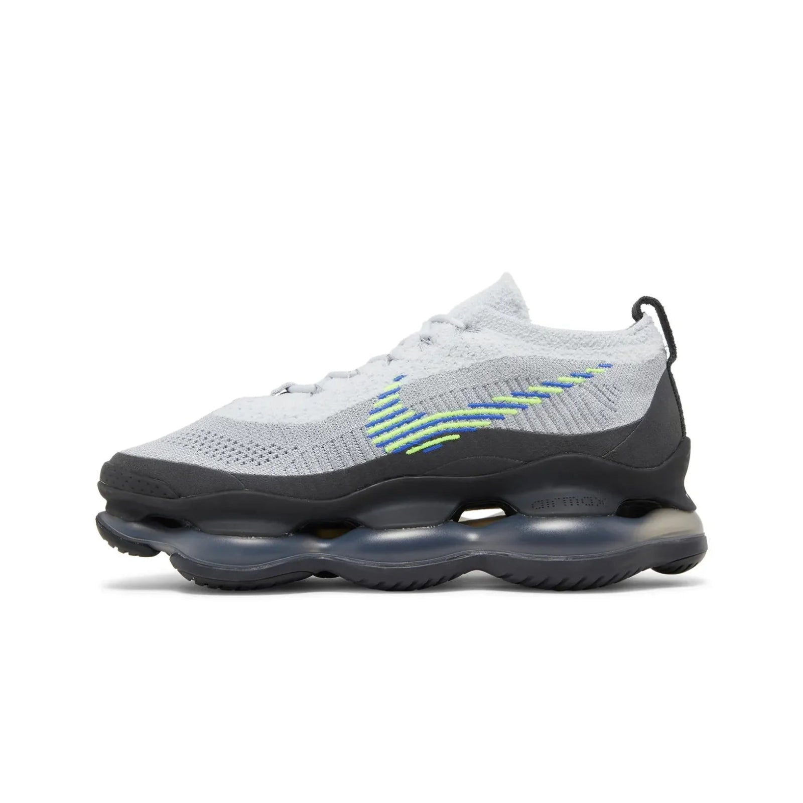 Gray and black sneaker with green accents on a white background