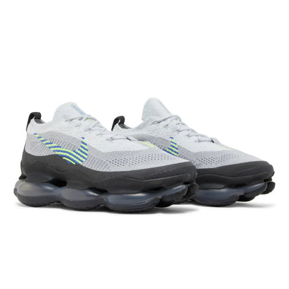 Pair of white sneakers with black soles on a white background