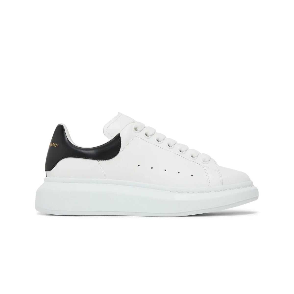 White sneaker with black heel on a white background